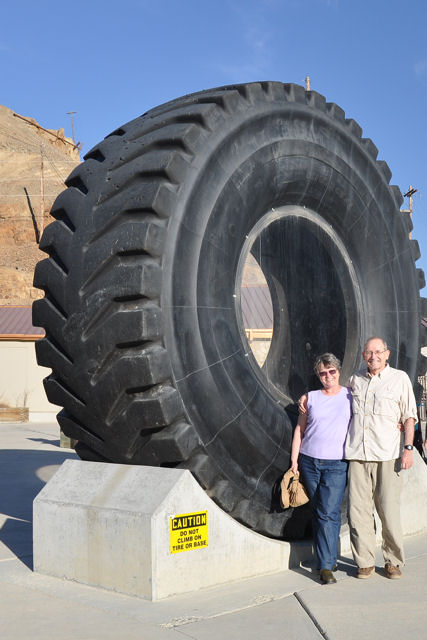 Bill and me with a tire from one of the mining trucks Kennecott Copper Mine